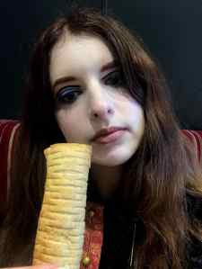 Angie with Greggs Vegan Sausage Roll